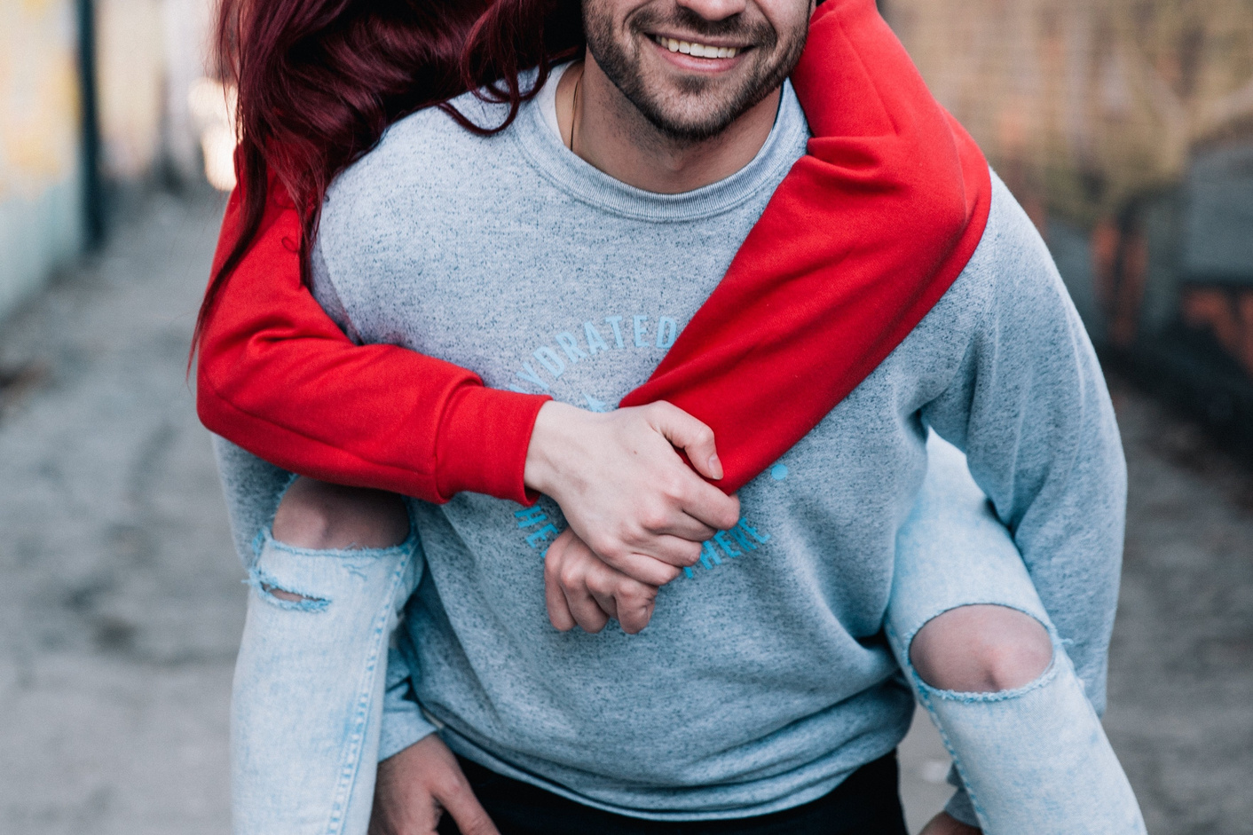 Couple Doing a Piggyback Outdoors